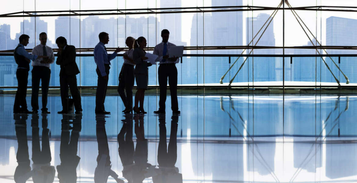 silhouettes of workers in an office