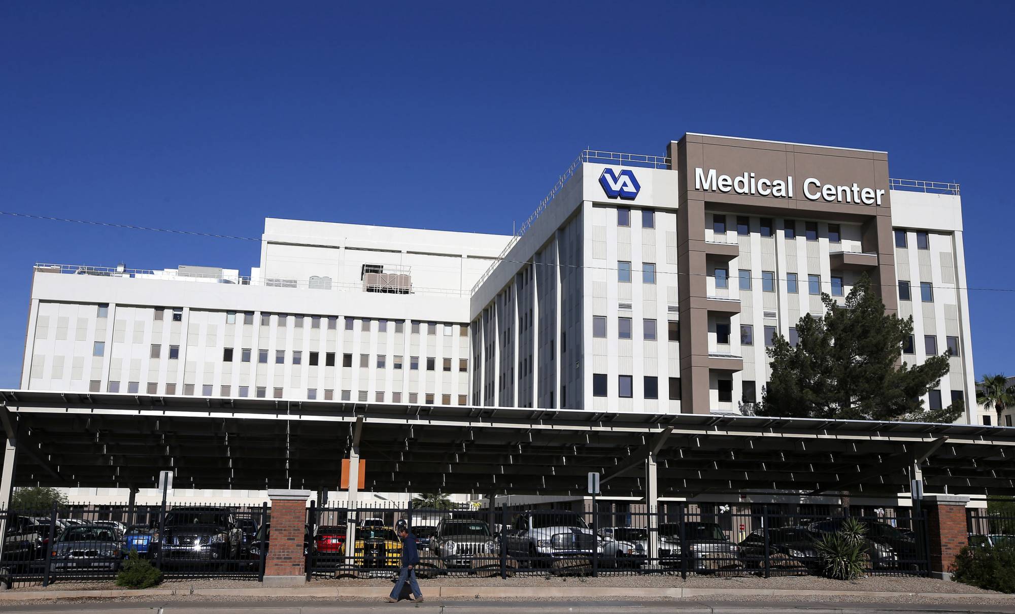 FILE - This Monday, April 28, 2014 file photo shows the Phoenix VA Health Care Center. Weeks after receiving emergency aid in August 2017, the Department of Veterans Affairs is cautioning that the Veterans Choice private-sector health program backed by President Donald Trump could run low again on money sooner than expected, threatening to disrupt care for hundreds of thousands of veterans in two months. (AP Photo/Ross D. Franklin)